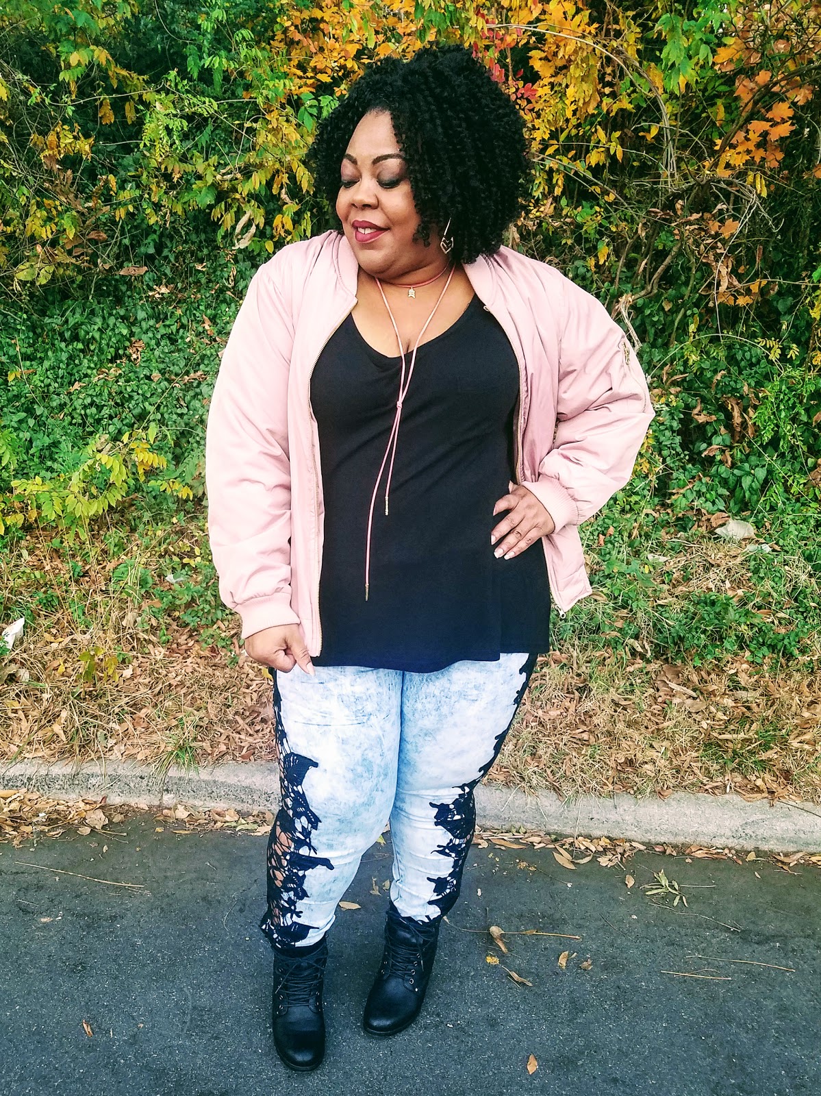 Natural hair, pink bomber jacket, statement jeans, stacked booties, pink faux suede tie necklace