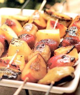 Mixed fruit kebabs: mixed fruit threaded on skewers and cooked on a barbecue. A classic outdoor dessert.