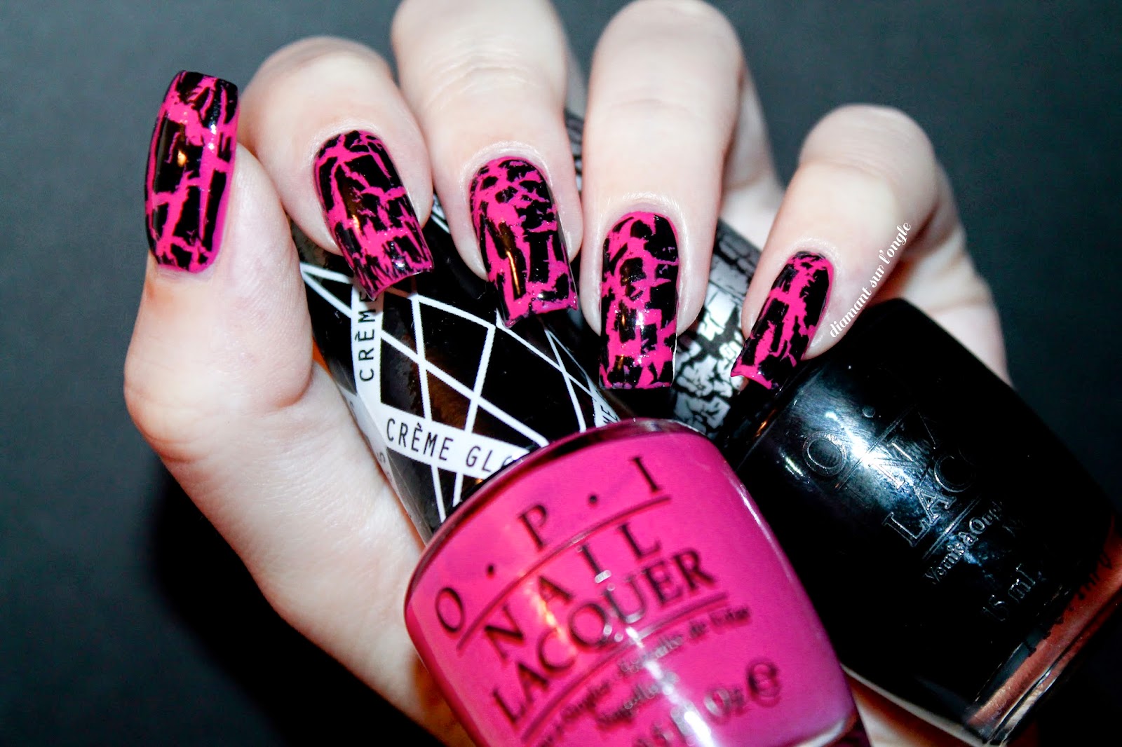 black and pink nail art done with a black shatter nail polish