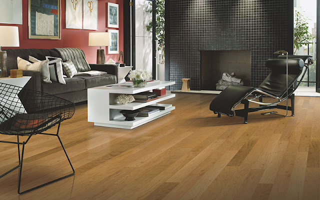 Beautiful hardwood flooring opens up this living area