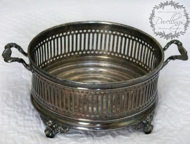 Silver dish turned candle holder.