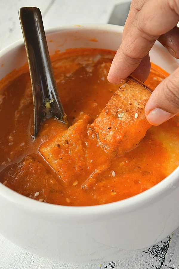 Easy Homemade Tomato Soup served with croutons,cheese
