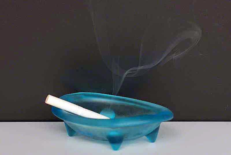 burning cigarette, ashtray, smoke