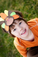 girl in thanksgiving turkey hat NAMC montessori community celebration of thanksgiving