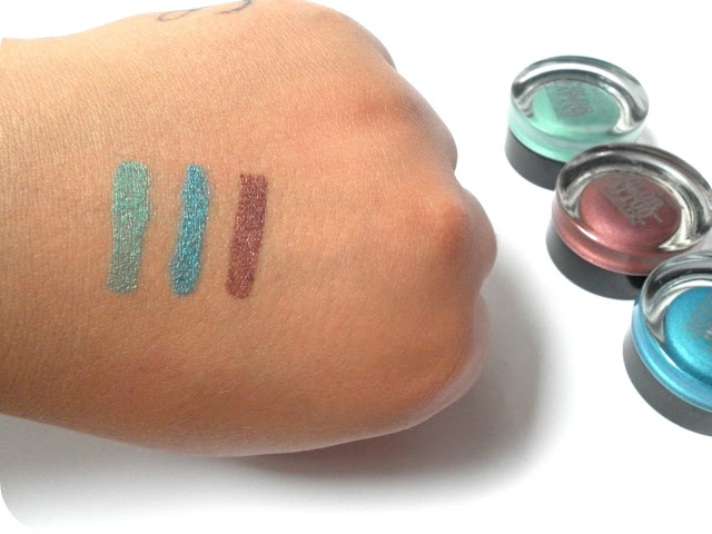 A picture of Maybelline Color Tattoo swatches in Edgy Emerald, Tenacious Teal and Pomegranate Punk