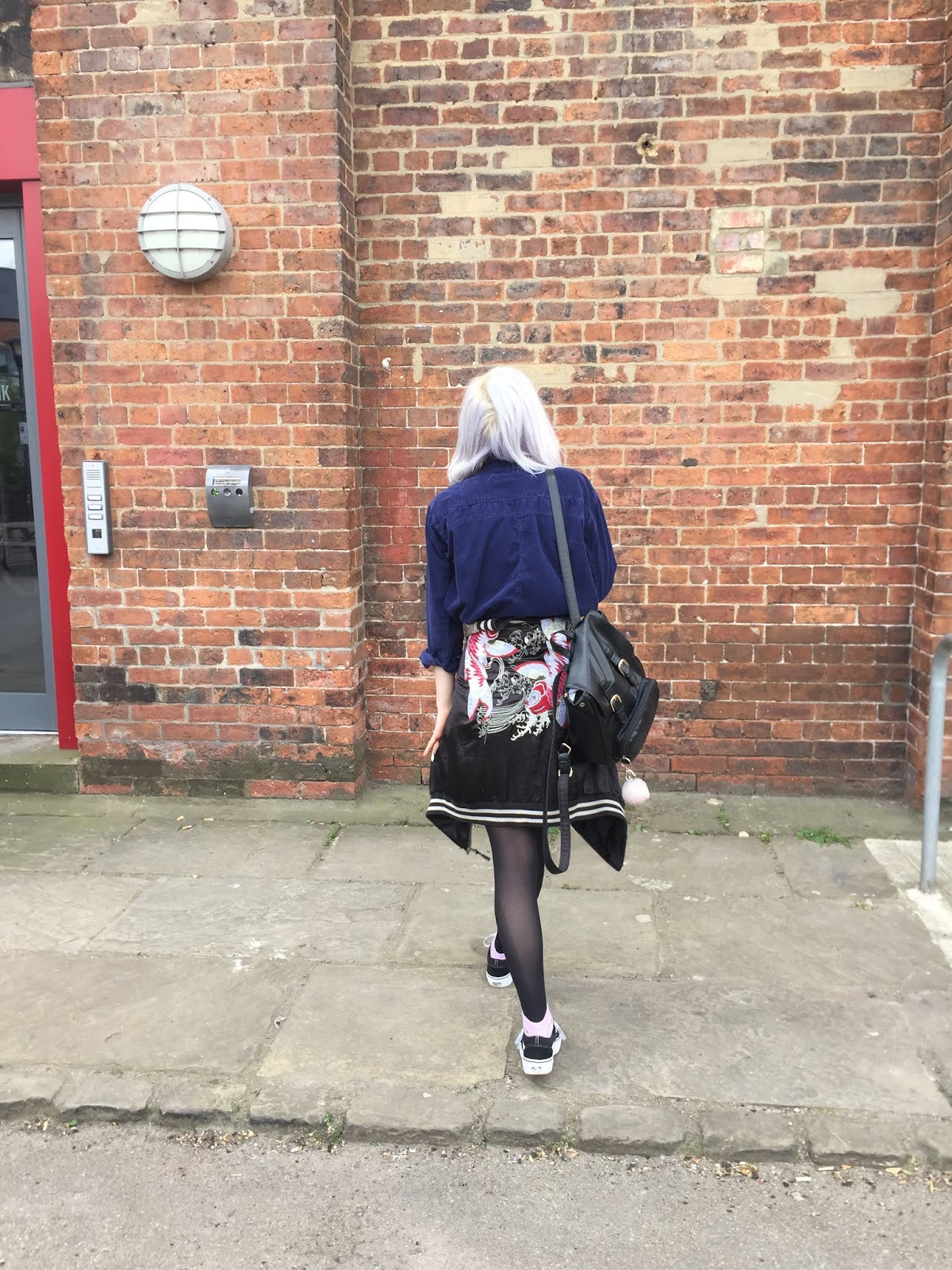 silver haired girl wearing vans, vintage navy shirt and souvenir jacket