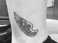 Small Angel Wings Tattoo On Chest For Girls