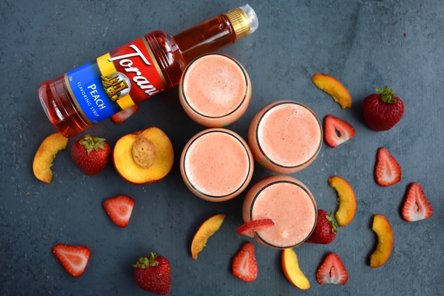 Strawberry Peach Wine Slushies are super refreshing and are perfect for easy entertaining with only 4 ingredients and take 2 minutes to make! www.nutritionistreviews.com