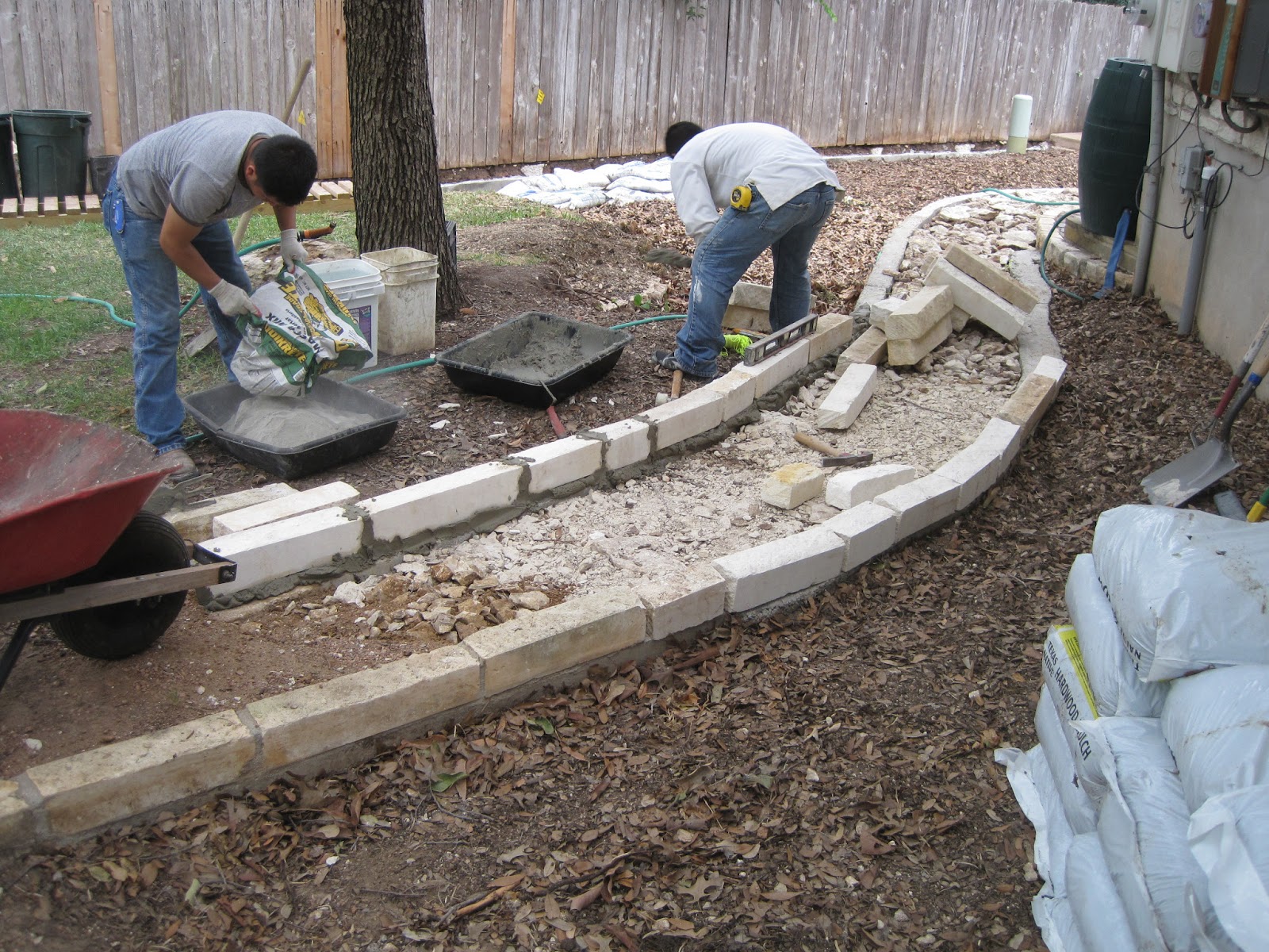House Remodelling Laying down the limestone blocks on top of the