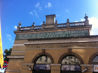 Ghost sign on Gloucester Road tube station, London