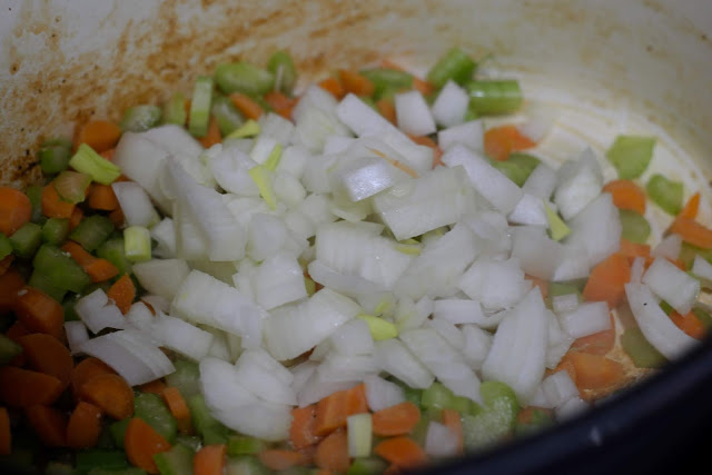 Diced onion, carrots, and celery in the pot. 