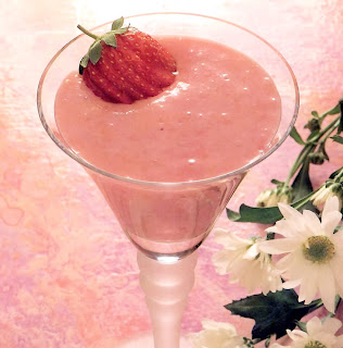 Strawberry cloud: classic vegen dessert of strawberry puree in a tofu base served in a glass and garnished with a whole srawberry