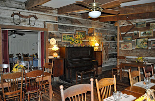 An inside image of Gaine's Ridge Dinner Club, Camden, Alabama with three dining tables
