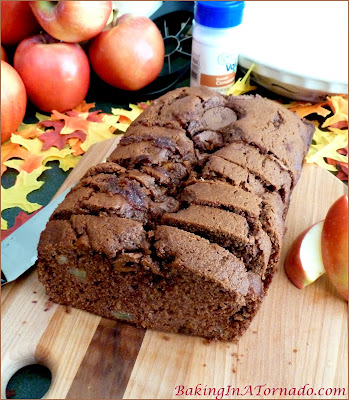 Caramel Topped Apple Spice Bread, a quick bread filled with fall flavors, chopped apples and spices. Topped with caramel filled chocolates | Recipe developed by www.BakingInATornado.com | #recipe #bake