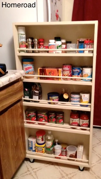 Slide out pantry filled with dry goods