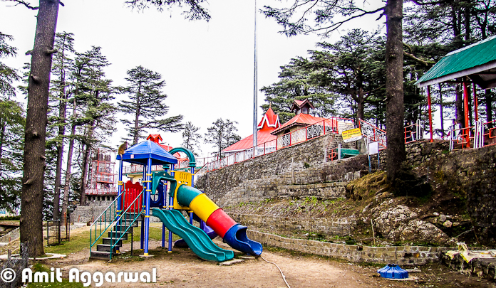 Jakhu Temple is very popular Temple in Shimla and know for various reasons. People who have never visited Shimla, know Jakhu for hundreds of monkeys around it. Different Monkey stories are popular and Jakhu is one of the important keyword in those stories. Let's check out this Photo Journey by Amit Aggarwal to know more about Jakhu Temple and other specialties of the place..In 2010, a huge statue of Hanuman is built near Jakhu Temple in Shimla. This is considered as world's tallest statue at 108 feet at the highest altitude of over 8100 feet and constructed at a cost of Rs 1.5 crores, which surpasses the current tallest statue of 'Christ the Redeemer', which measures at 98 feet and stands at an altitude of 2296 feet in Rio de Janeiro, Brazil.Over the years Jakhu has become one of the important part of Shimla town and authorities have improved the conditions in past few years. Now this campus has enough space for families to have fun around the Temple. There are some special arrangements for kids.Basically this temple is located on a hill called Jakhu and that's why the temple is also known as Jkhu Temple.It's hardly 2 kilometers from the Ridge and is an uphill climb through the beautiful deodar trees. It's  a trek of approximately 2 kilometers from Ridge ground near Mall Road. The Jakhu Temple of Simla is dedicated to the monkey God, Hanuman. The Jakhu temple is located at a height of 2455 meters and is situated on the highest peak in Shimla. The scenic view that surrounds this beautiful temple of India is absolutely breath taking and splendid.Here is a photograph of Jakhu Temple !Jakhu temple has an interesting legend behind it. It is said that a deadly arrow injured Lord Rama's brother Lakshmana when he was fighting the battle with the demon king Ravana. A priest diagnosed Lakshmana and said that he needed a particular Sanjeevani herb from the Himalayas to cure Lakshmana. Hanuman was sent to get that herb from he lofty mountains. Upon reaching the Himalayas, Hanuman couldn't make out as to which herb was the Sanjeevani. So he dug up the entire mountain and flew back to where Lakshmana was lying injured.After Lakshmana was cured, Hanuman went back to place the mountain in its original site. He rested on top of the Jakhu hill for sometime. It is said that the top of the hill got flattened due to Hanuman's weight! The temple has been built around the place that is supposed to have the footprints of Hanuman. It is a highly revered religious place of Shimla and devotees throng in huge numbers to prayJakhu is a hotspot for monkeys who flock here in great numbers and generously accept eatables that are given to them by devotees and touristsJakhu is derived from Hindi word Yakhsa. Yakshas are the mythological character in Hindu mythology, who are a link between human and gods. The original dates of temple is not known, but it is believed to be existing from the times of Ramayana, a pre-historic event as per ancient Hindu texts. The Jakhu hill is the highest peak around Shimla, and is famous for its trekking options. The Jakhu hill offers excellent views of sunrise, sunset, mountains and town. The hill is full of narrow paths and roads which are an enjoyable walks.There are lot of other stories associated with this temple, which can be seen at different web portals online.Overall it's a lovely hill around Shimla with some amazing views. Don't afraid of Monkeys and try to avoid the opportunities for them to follow you - Try  not to carry anything in your hands, just follow the path and don't pay attention to the etc.  Even someone comes to you and tries to check your pockets, let the things happen and you will be safe !