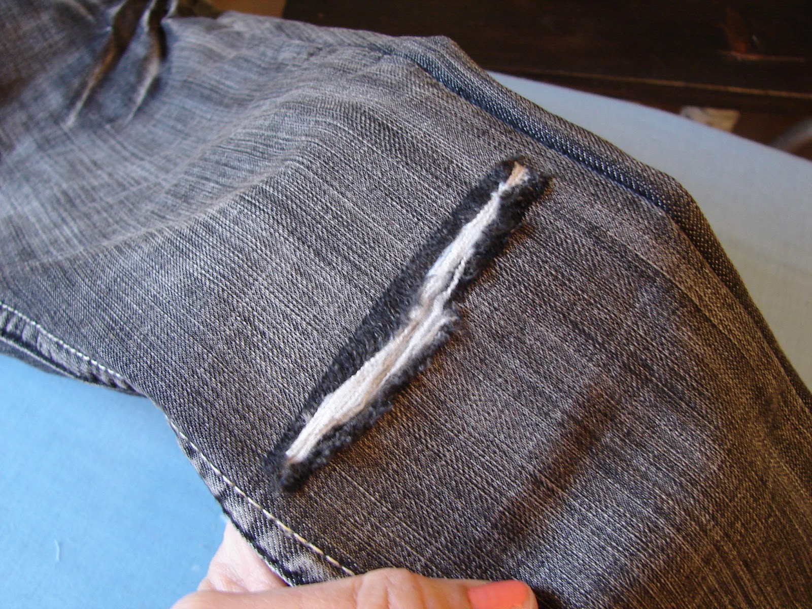 how to fix a hole in jeans..... A girl and a glue gun