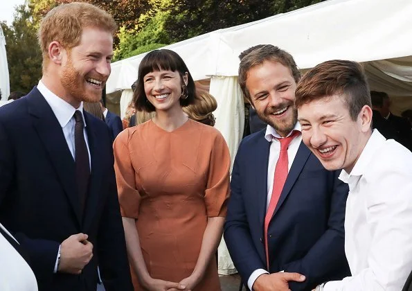 Meghan Markle wore a bespoke black sleeveless dress by Emilia Wickstead, and Deneuve shoes by Aquazzura. She carried a black satin clutch by Givenchy