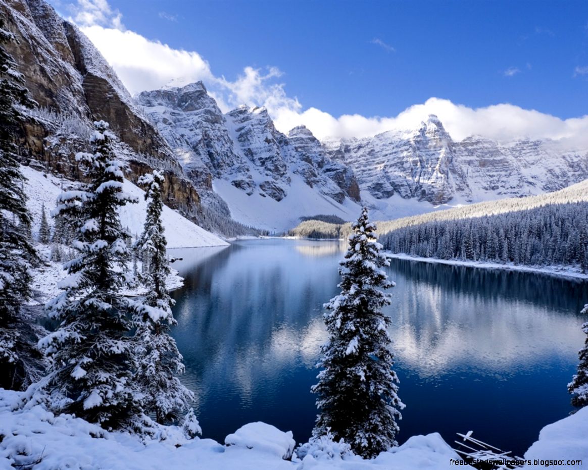 Winter snow covered mountains and trees icy lake Wallpaper