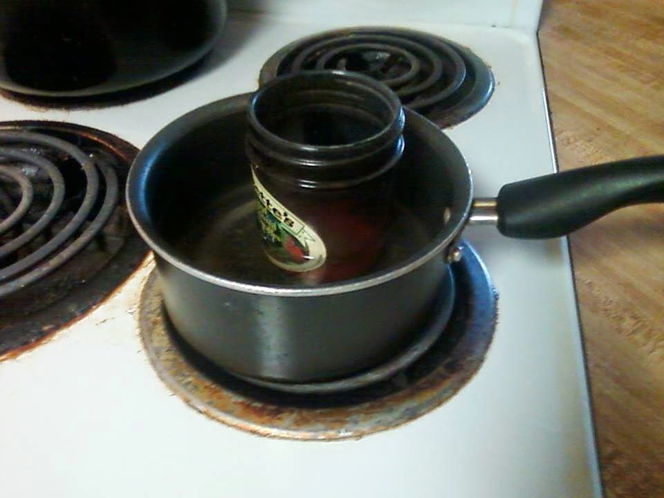 After cutting a 1 in strip off of a pepsi can she rolled it into coil.