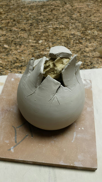 Hatching dragon pottery egg by Lily L, in progress.
