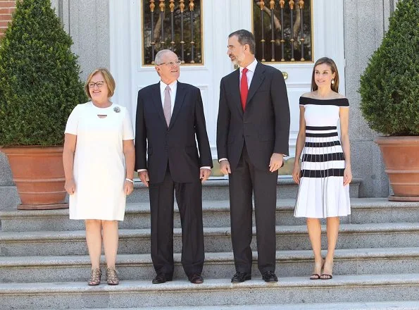 King Felipe and Queen Letizia, President Pedro Pablo Kuczynski and wife Nancy Lange. Queen Letizia wore Carolina Herrera Striped Off-The-Shoulder Knit Dress
