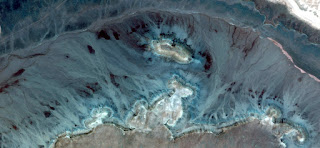 Allegory of Fossil of Tyrannosaurus Rex head frozen in dark blue and white stones, turquoise, abstract landscapes of deserts of Africa from the air, collection of Abstract Naturalism Munimara, Allegory of Fossil of Tyrannosaurus Rex head frozen in dark blue and white stones, turquoise, abstract landscapes of deserts of Africa from the air,