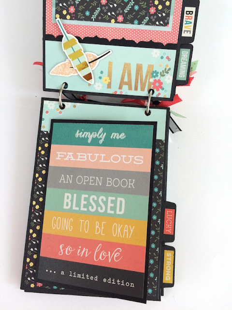 I am scrapbook album page with feathers and posive words of encouragement