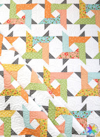 Windy City quilt pattern from A Bright Corner - fun twisted star blocks - a great jelly roll quilt pattern but you can also use layer cake, FQ or yardage too!