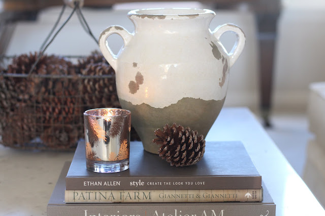 living-room-design-winter-decor-basket-pinecones-vase-candle