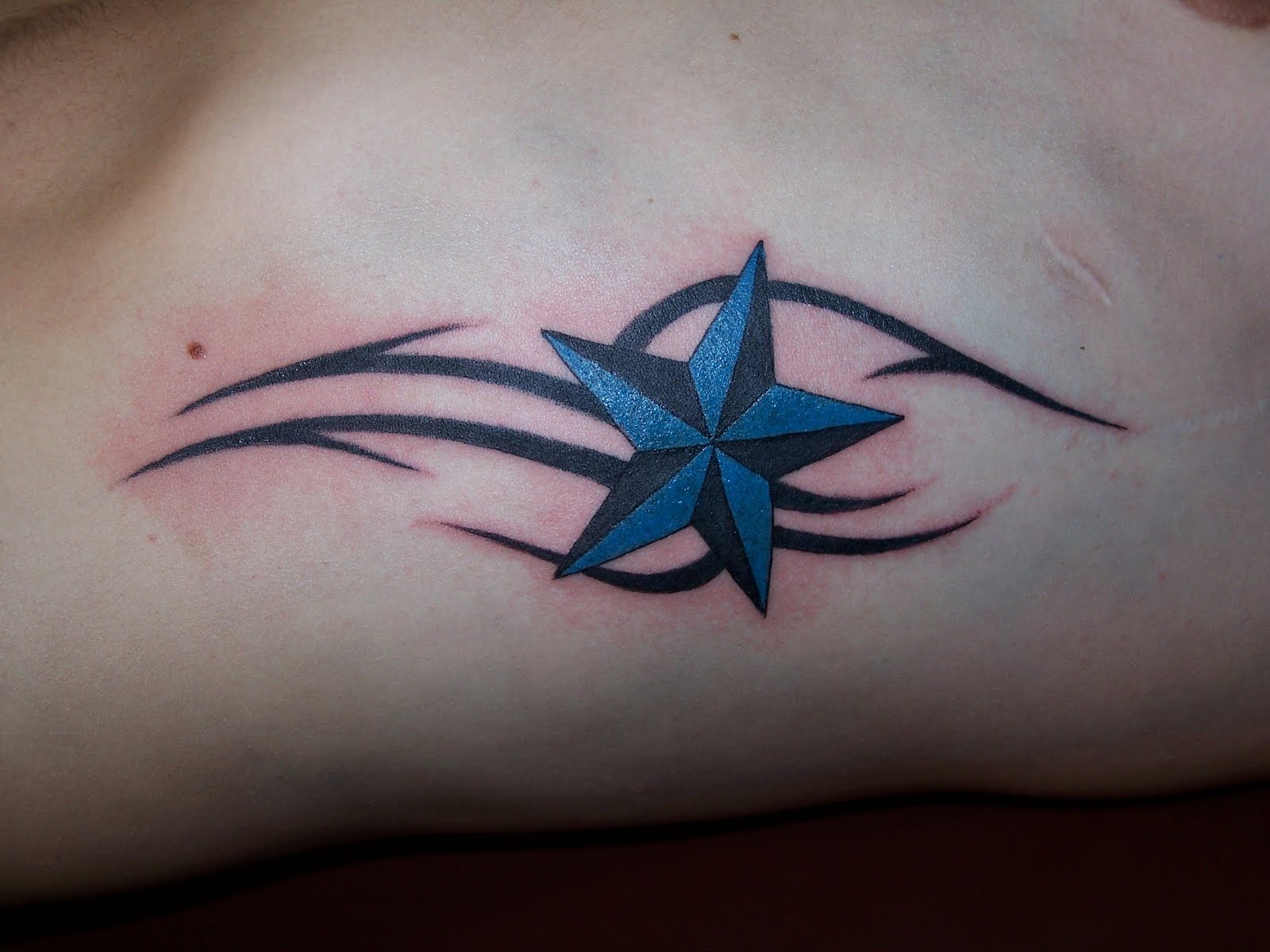 http://3.bp.blogspot.com/-P6TbhKONmOc/TnDoH5LSQMI/AAAAAAAAA3s/R5J0r9DXNto/s1600/images+star+tattoos.JPG