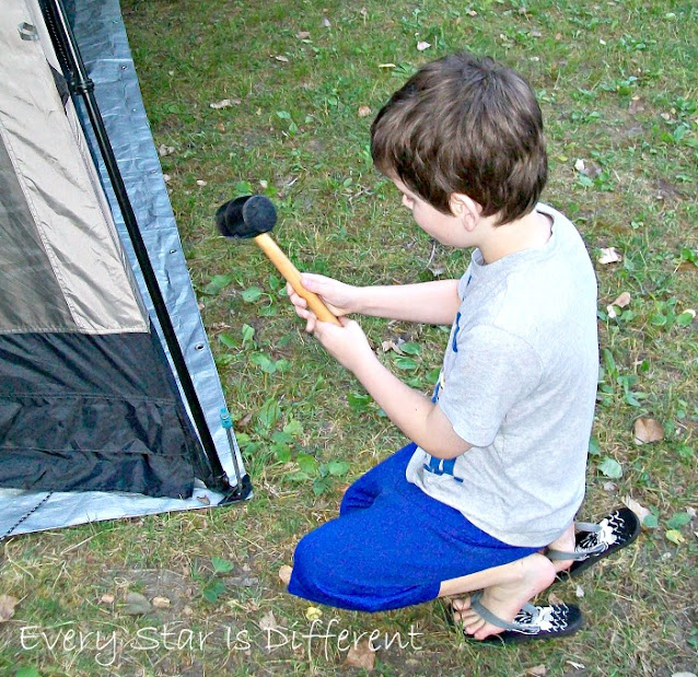 Setting Up a Tent: Hammering in the Stakes