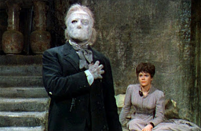 The Phantom (Lom) and Christine (Heather Sears) in the Phantom's lair
