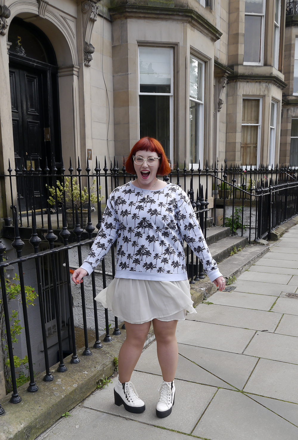 Scottish blogger, Edinburgh blogger, Scottish street style, quirky street style, dressing to a theme, food inspired outfit, pale girl style, Spex Pistols glasses, red head, red hair, H&M, patterned jumper, palm tree sweatshirt, white pleated dress, white boots, lace up shoes, milk necklace, Tiny Treat Boutique necklace, milk bottle jewellery, Lucky Dip Club