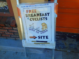 Sign reads 'Free Breakfast 4 Cyclists'