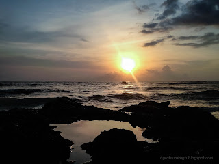 Natural Scenery Of Sunset View On The Sea Rocks At Batu Bolong Beach, Canggu Village, Badung, Bali, Indonesia