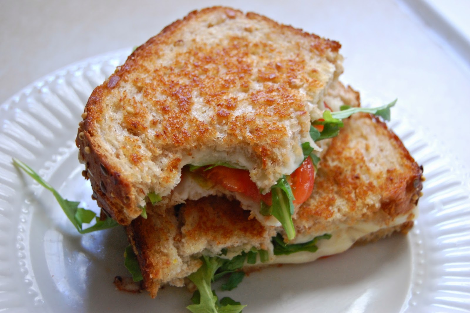 Poppi Linn Grilled CheeseJarlsberg, Mozzarella, Arugula, Tomato