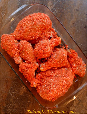 Baked Spicy Cheetos Chicken, chicken soaked in a buttermilk mixture then coated in a crunchy panko cheetos crust makes for a moist interior and an crunchy exterior. | Recipe developed by www.BakingInATornado.com | #recipe #dinner #chicken