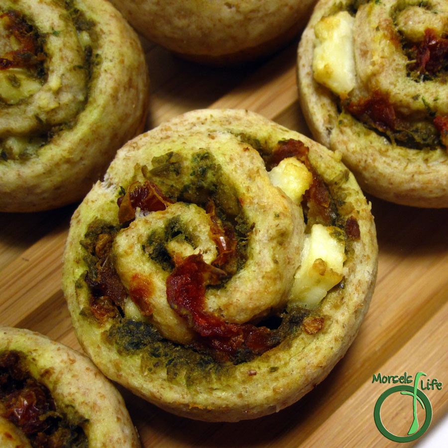 Morsels of Life - Sun-Dried Tomato Pesto Swirl Biscuits - Perfectly combine pesto, sun dried tomatoes, and feta cheese into a swirl biscuit with Mediterranean flair.