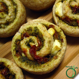 Morsels of Life - Sun-Dried Tomato Pesto Swirl Biscuits - Perfectly combine pesto, sun dried tomatoes, and feta cheese into a swirl biscuit with Mediterranean flair.