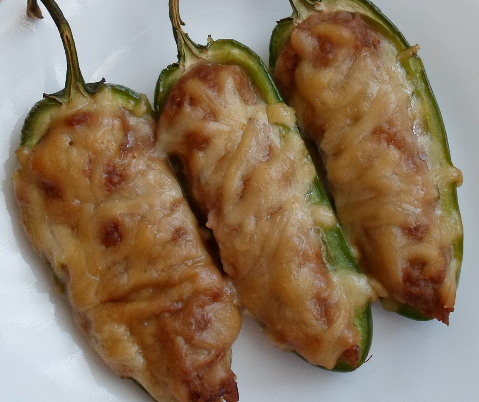 Happier Than A Pig In Mud Refried Bean and Cheddar Stuffed Jalapenos