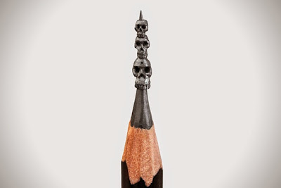 Micro Escultura de calaveras en la punta de un lápiz