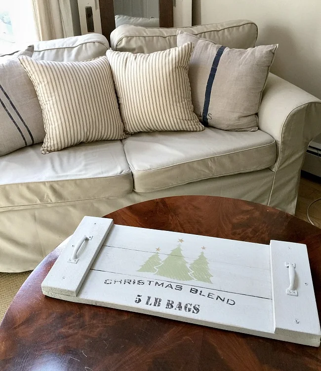 white serving tray on coffee table in front of sofa