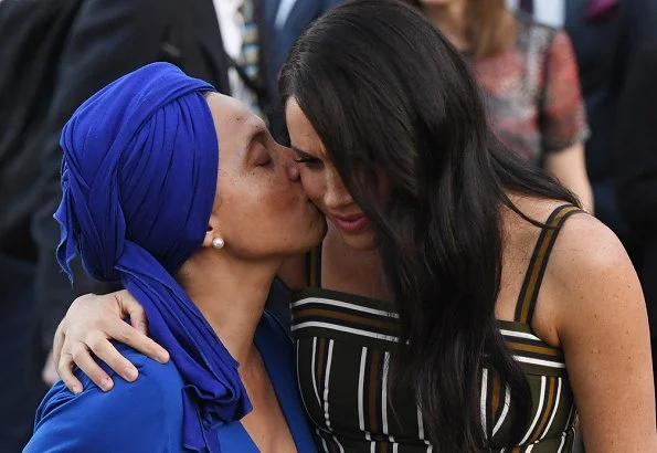 Meghan Markle, The Duchess of Sussex, wore Martin Grant pleated stripe long dress. Prince Harry