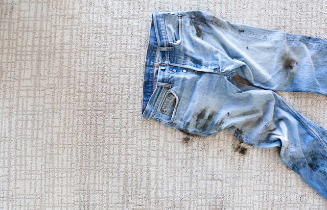 dirty jeans staining a beautiful pale, patterned carpet