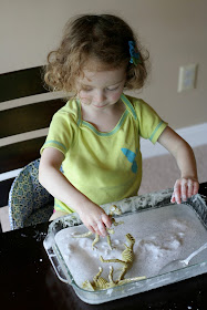 Frozen Sensory Snow - Easy, cheap (cost around one dollar!), and the icy cold lasted for TWO hours while we played!  Perfect for keeping cool this summer from Fun at Home with Kids