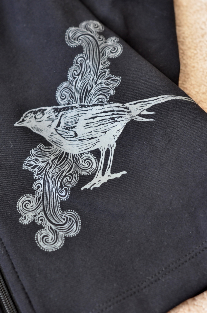 Bird Design Detail on Albion Fit's 26.2 Jacket in Black - Photo by Taste As You Go