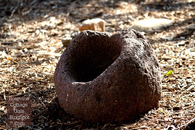 A stone metate ( meal grinder) used to grind grain at the San Juan Capistrano Mission in California