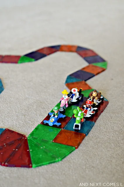 Building a rainbow road out of Magna-Tiles, inspired by the game Mario Kart from And Next Comes L