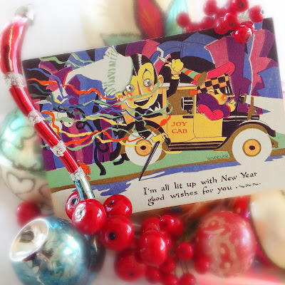 vintage style ornaments and holly berries surround 1920s art deco card with tuxedo man in yellow taxi